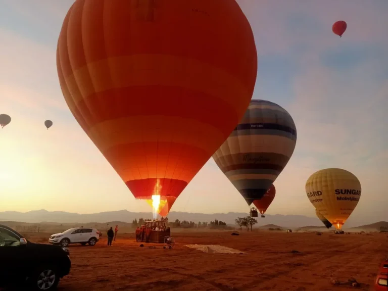 Burner flame filling a hot air balloon at sunrise near Marrakech