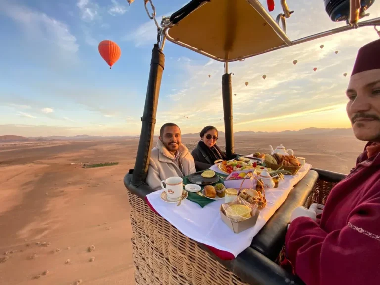 Private hot air balloon basket with breakfast table above the desert near Marrakech