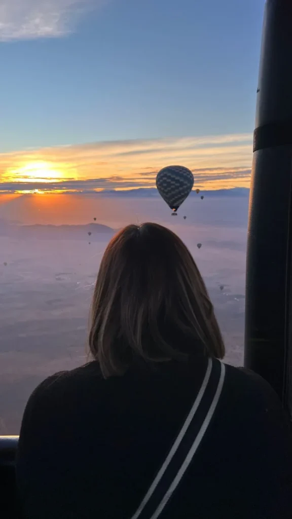 Sunrise seen from a hot air balloon basket above Marrakech