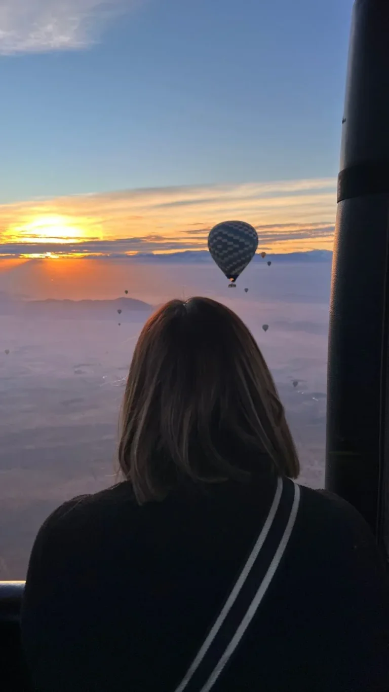 Sunrise seen from a hot air balloon basket above Marrakech